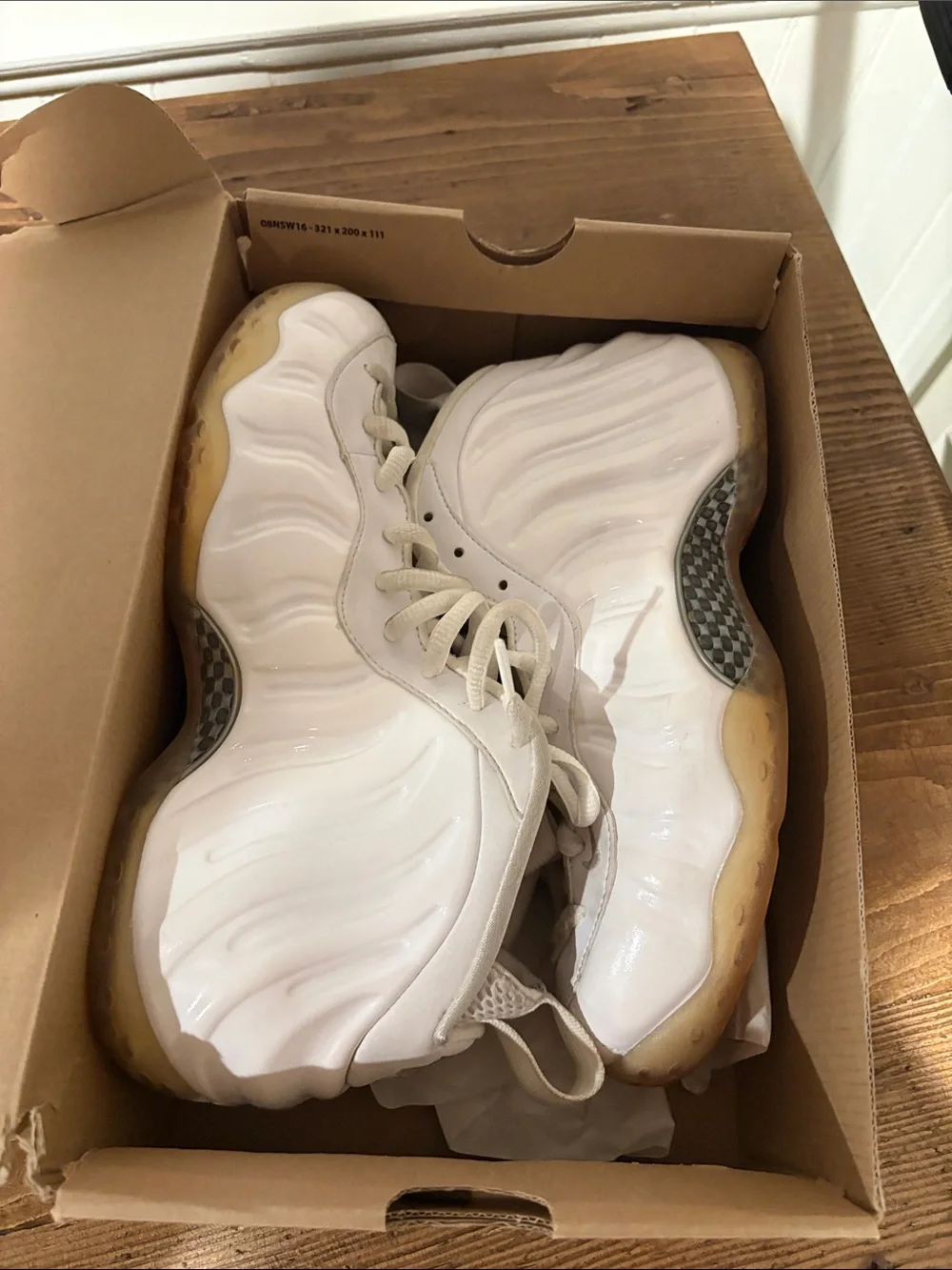 Nike Men’s White Foamposite Sneakers with Yellowed Sole